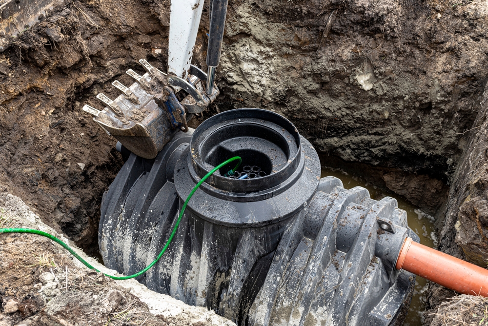 Installation,Of,A,Single-chamber,Home,Sewage,Treatment,Plant,,The,Excavator